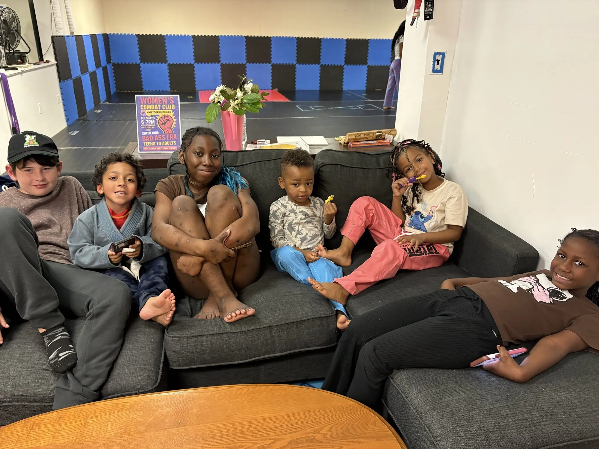 A family relaxing together on a couch at the community centre