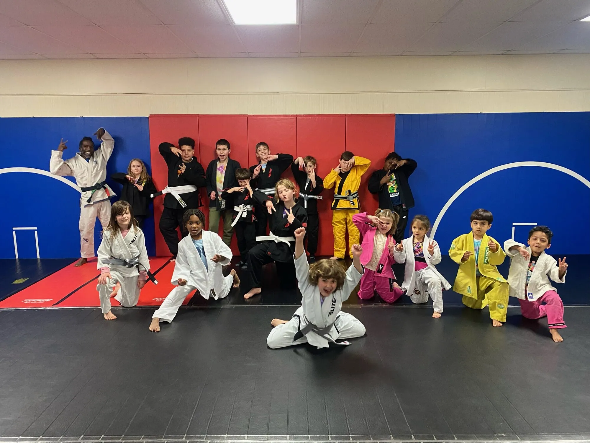 A group of children in gis lined up for a Yinjas class